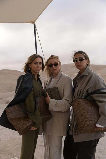 three women modelling in the desert