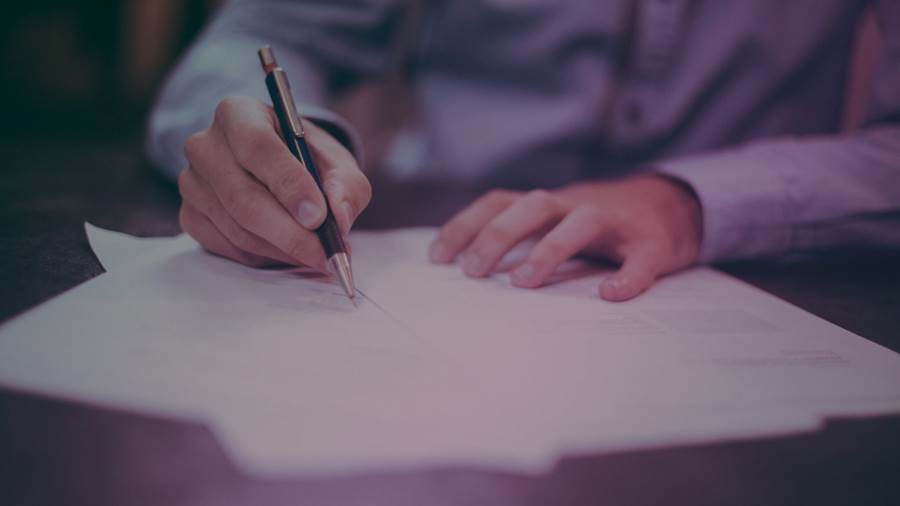 Features Not Fees Blog 2 hand writing with pen on paper