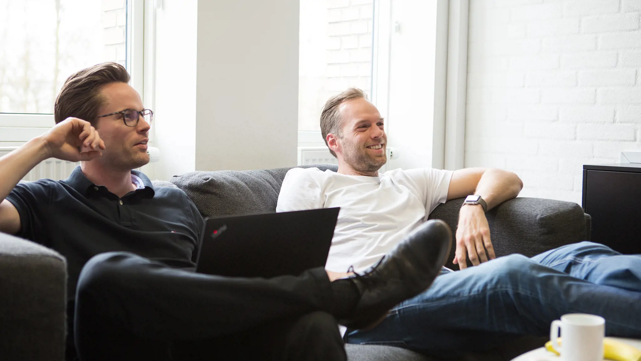 Laughing in sofa Laughing in sofa at Novicell