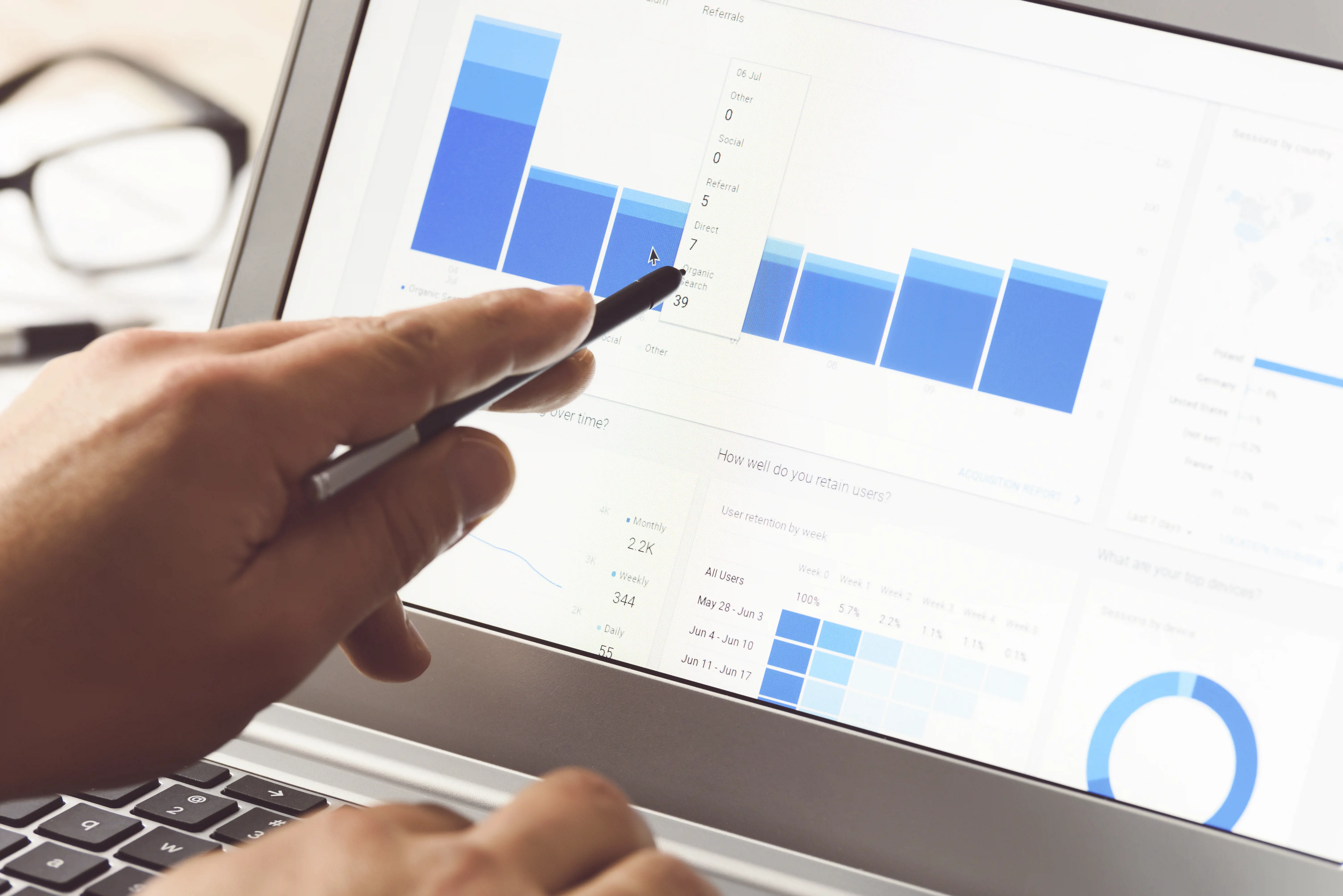 hand pointing at charts